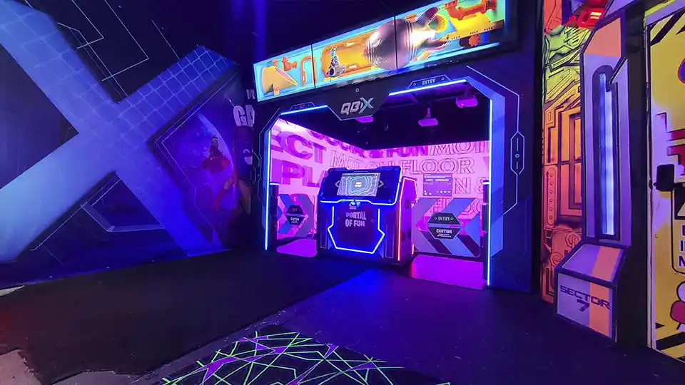QBIX interactive game room entrance in Hurricane Utah near Zion with neon arcade style attraction setup