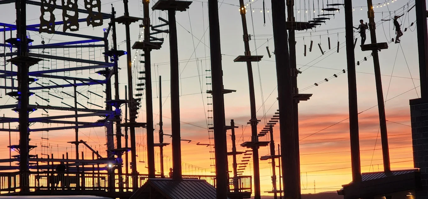 Ropes course near Zion in Hurricane Utah at sunset with elevated obstacles, climbing platforms, and aerial adventure elements