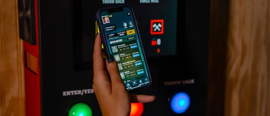 Mobile app showing scoring and game tracking at Wiked Timber Axe Throwing in Hurricane Utah highlighting interactive lanes and auto scoring near Zion